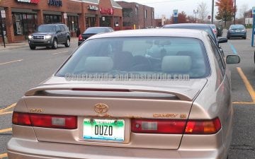 Ouzo ! Happy New Years! - Vanity License Plate by Busted Ride